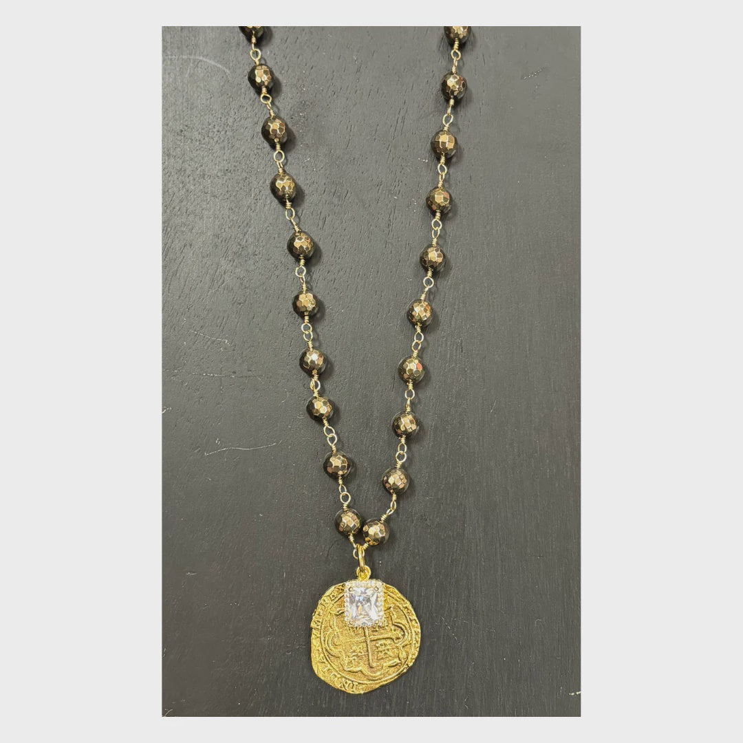 necklace with crystal and gold coin pendant
