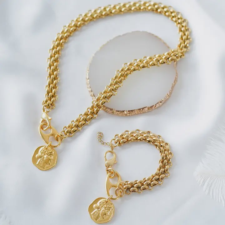 Gold chain with charm Face